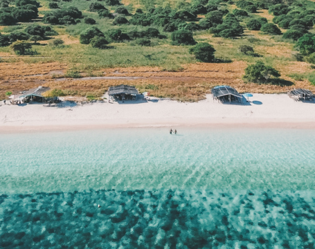 Aerial view of a tropical beach with clear turquoise water
